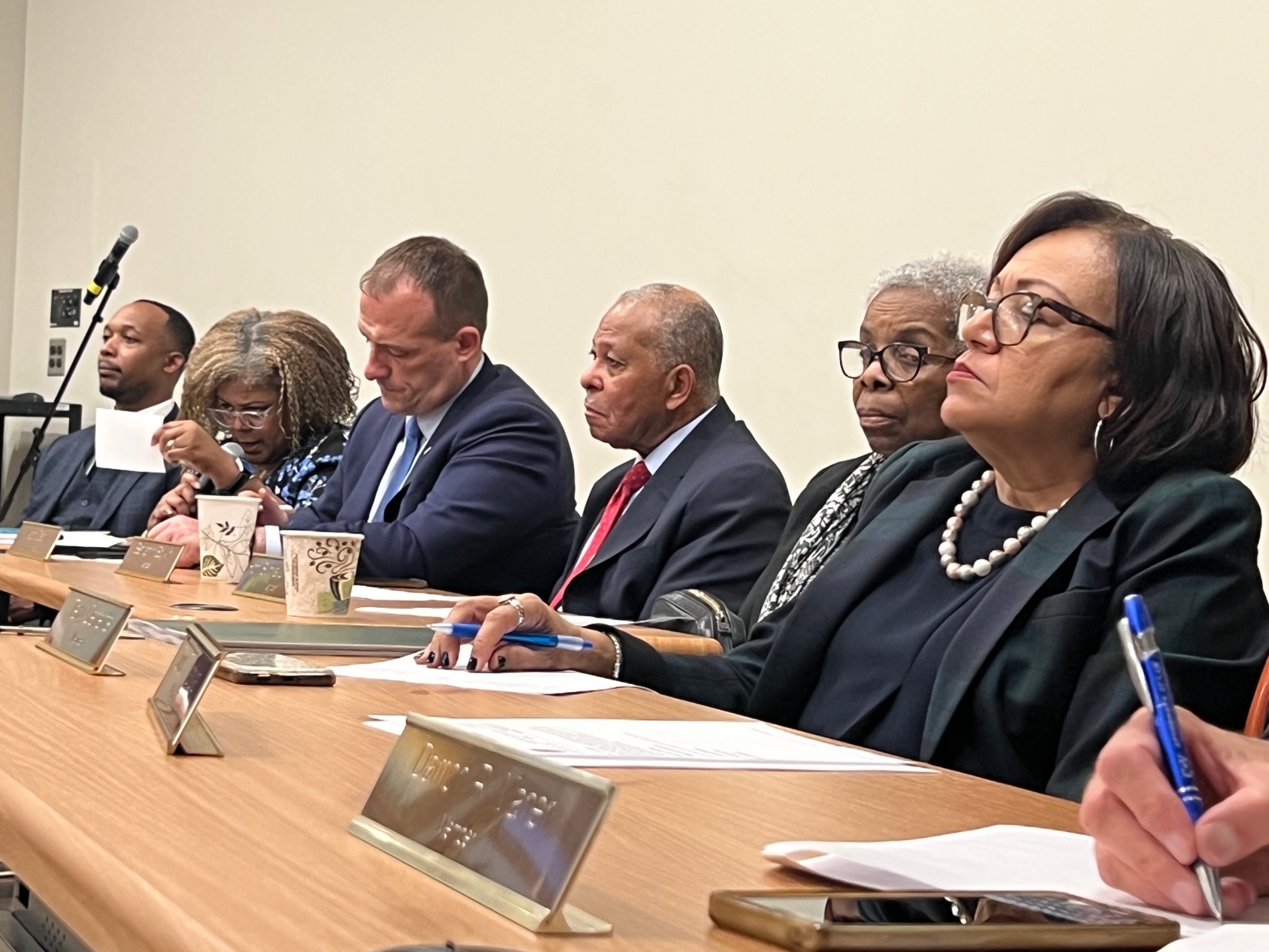 picture of legislators listening to speakers at public input session