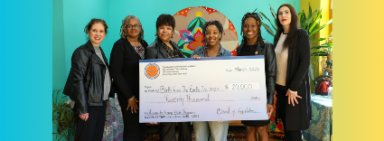 Westchester County legislator Shanae Williams presents a $20,000 check to Nubia Martin, founder and CEO of Birth from the Earth, Inc
